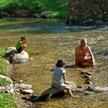 Cold refreshing bath in the stream close to the hot springs
